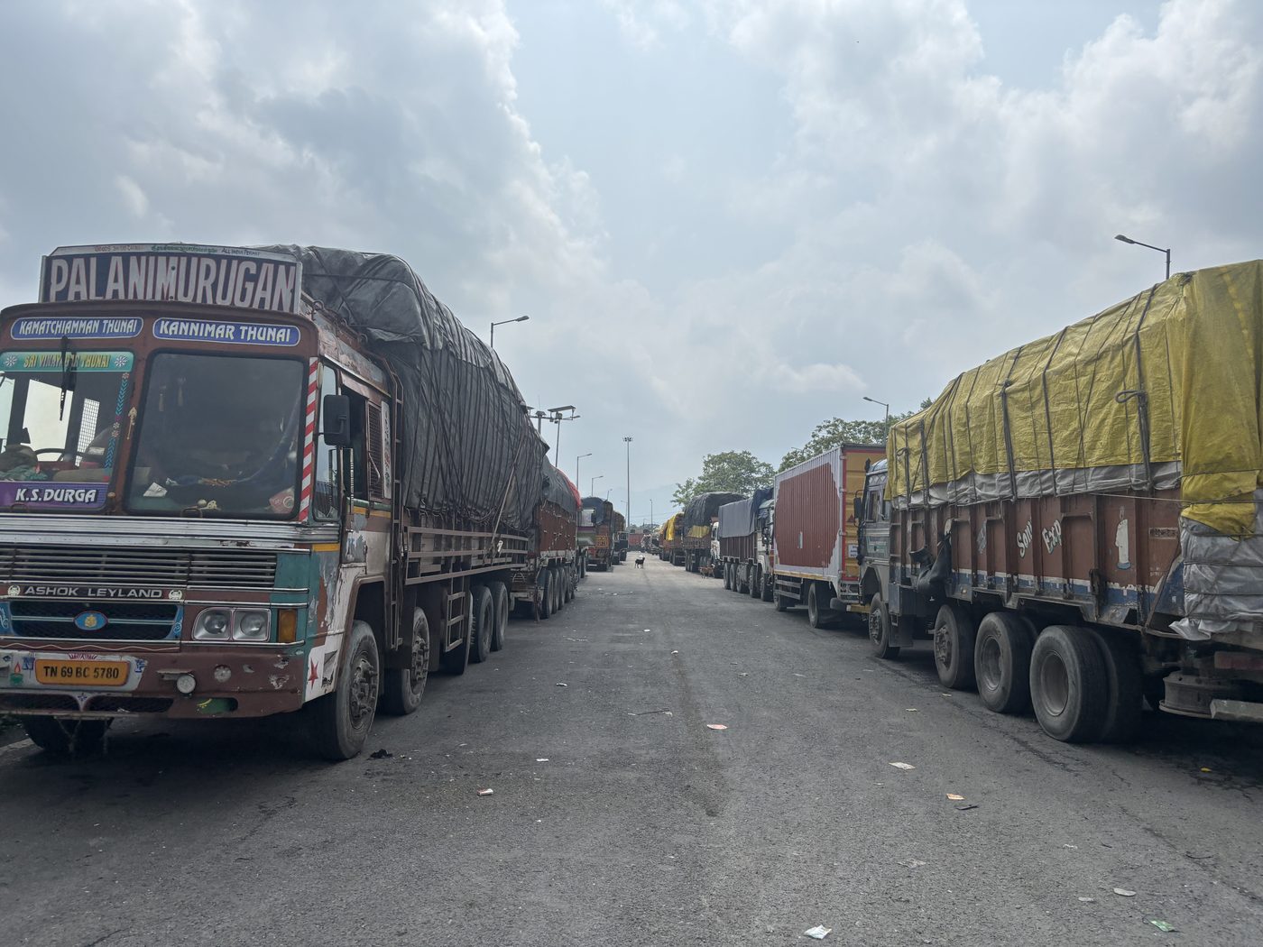 Loaded goods trucks queued on the highway to Jaigaon–Phuentsholing, India–Bhutan border
